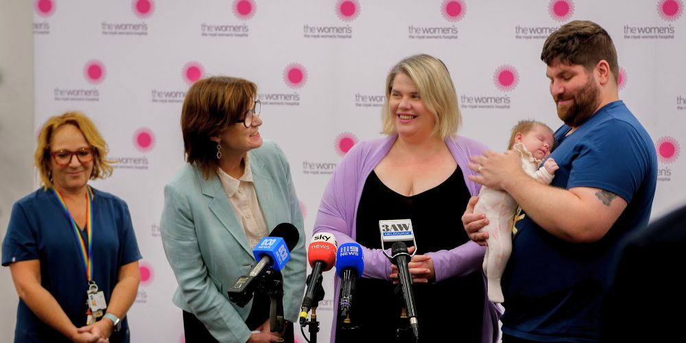 Cassie with Steven and baby Xena at the media conference. Also shown are Victoria's Health Minister Mary-Anne Thomas and A/Prof Kate Stern. 