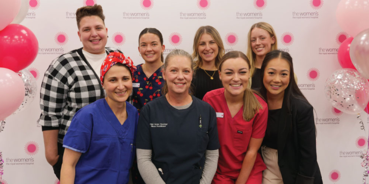 Winners of the 2024 Nursing and Midwifery Awards smile at the camera, surrounded by balloons.