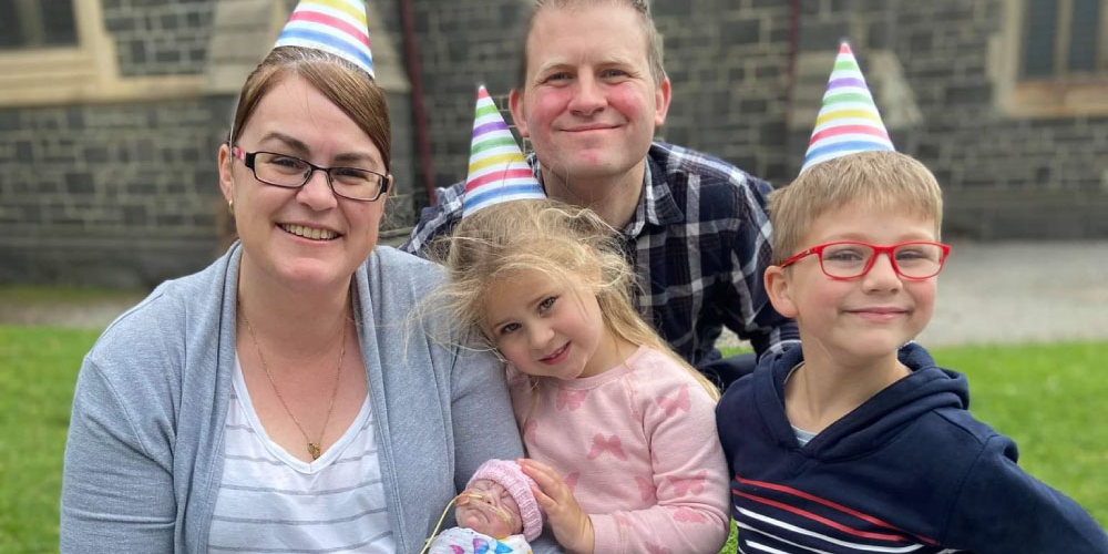 Baby Mylah with her big sister and brother and her mother Jodie and father Raoul enjoying a picnic