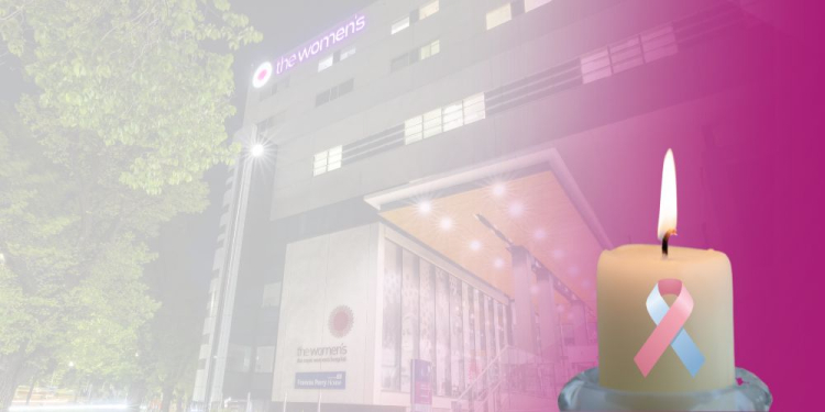 Lit candle with a pink and blue ribbon in front of the illuminated Women’s building. Text overlay reads: 'Tonight, we join the Global Wave o